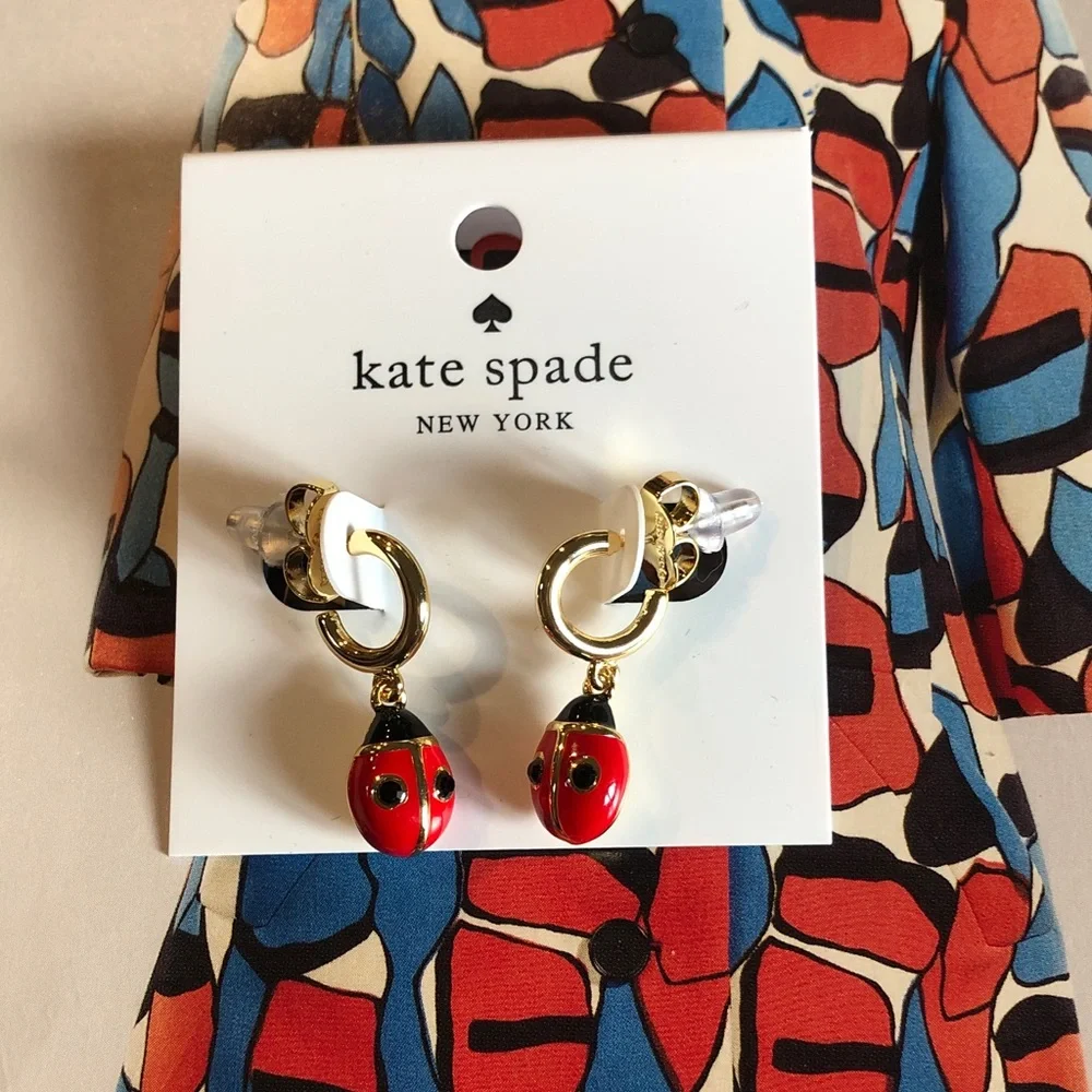 Authentic kate spade New with tag red and gold ladybug drop earrings.